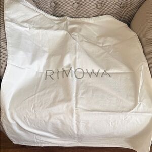RIMOWA Cream dust Cover from medium suitcase